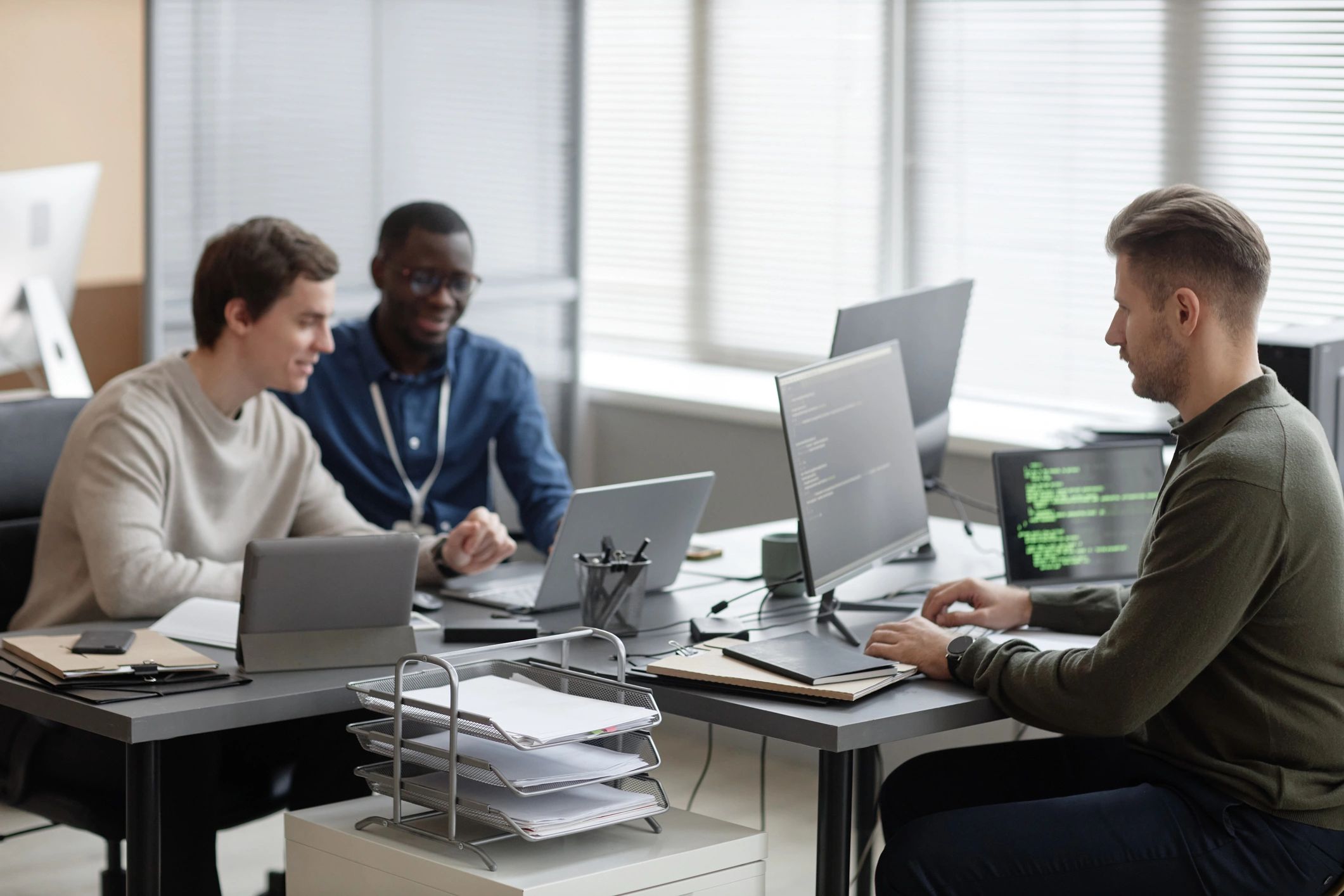 Akili IT team collaborating in a modern office